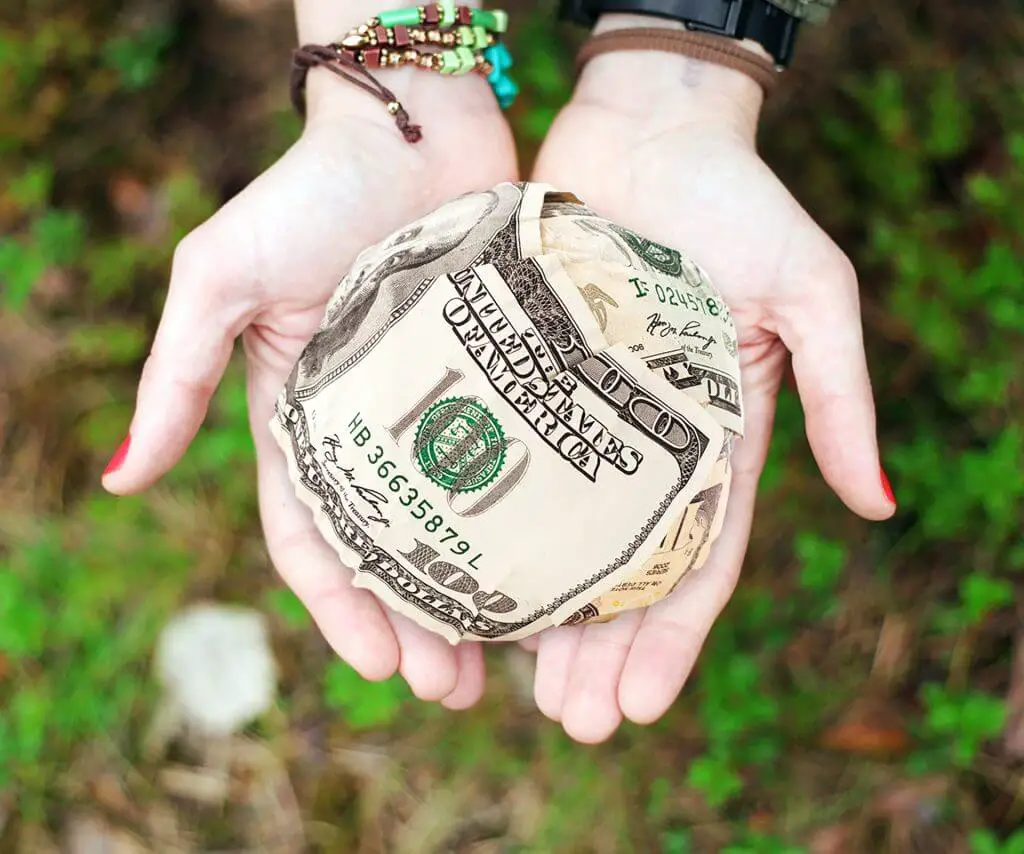 Money ball in someones hands