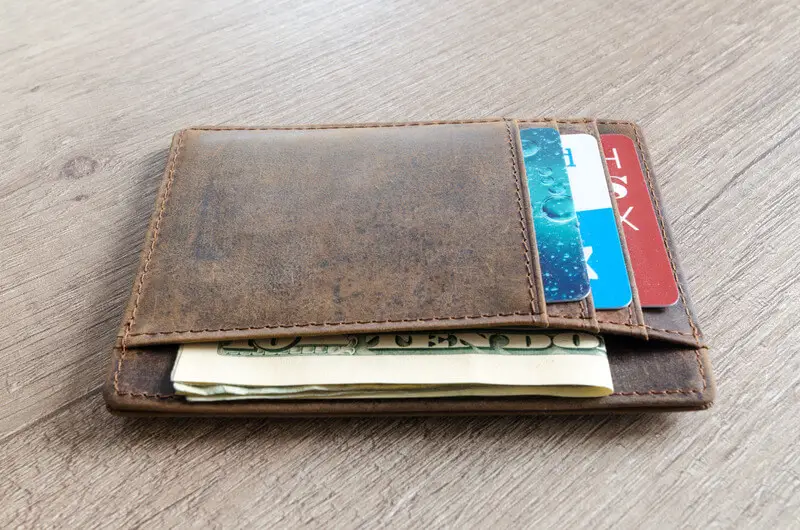 wallet with cards and money in it